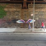 Under the Metro-North Railroad tracks, on a stretch of sidewalk covered with pigeon crap, you'll find this pair of angel's wings. Artist's name is illegible. Located at 111th St and Park Ave.